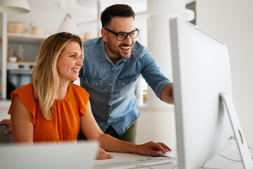 Programmers cooperating at IT company developing apps