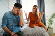 © NDABCREATIVITY - Frustrated young couple arguing and having marriage problems. Divorce conflict people concept