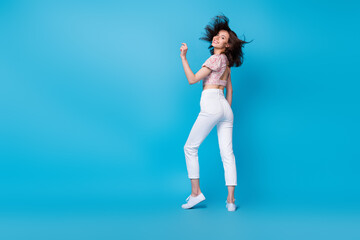 Poster - Full length photo of pretty adorable millenial lady dance enjoy rejoice cool weekend vacation empty space isolated on blue background