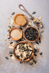 Wall Mural - Bowls with different seeds as ingredient for oil and healthy meal