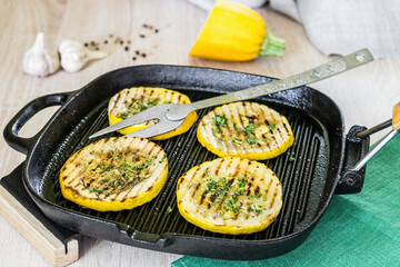 Grilled zucchini cooked in a homemade frying pan.