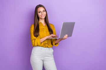 Sticker - Photo of positive pretty girl hold use wireless netbook good mood toothy smile isolated on violet color background