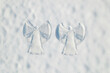 © flowertiare - Snow two angel couple print on a snow covered land. Aerial, top view. Drone photo. Winter