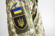 Armed Forces of Ukraine. Ukrainian soldier. Ukrainian flag on military uniform.