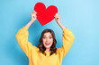 © deagreez - Photo of young attractive pretty gorgeous nice toothy excited woman hold red paper heart positive mood funky isolated on blue color background