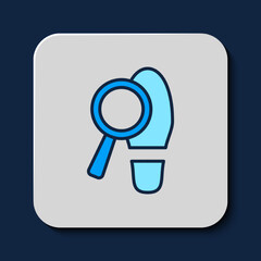 Poster - Filled outline Magnifying glass with footsteps icon isolated on blue background. Detective is investigating. To follow in the footsteps. Vector