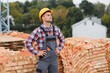© Serhii - Construction worker in uniform and safety equipment have job on building. Industrial theme