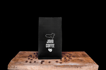 Wall Mural - Java coffee beans and black package on wooden board with black isolated background