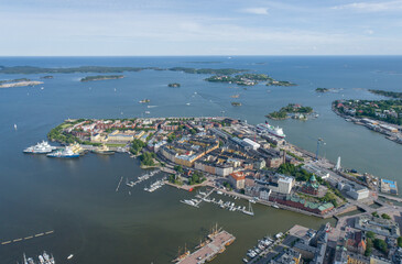 Wall Mural - Katajanokka area in Helsinki, Finland. Beautiful Cityscape with Harbour and Sea in Background. Drone Point of View.