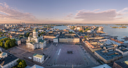 Canvas Print - Helsinki Cityscape. Finland. Helsinki Cathedral, Old Town and South Harbor and Market Square Kauppatori in Background. Sunset Colors. Drone Point of View.