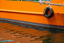 Orange Boat With Reflection