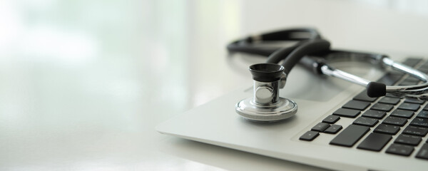 repair or maintenance computer and software concetp. Stethoscope medical on laptop. 