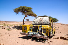 Yellow Car Wreck In Sahara Desert, Morocco