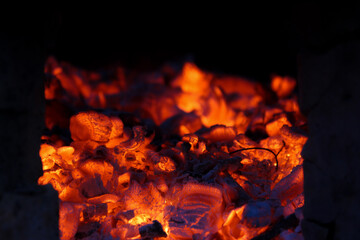 Scorched coals. Heat in the oven, fireplace, firebox. Close view.