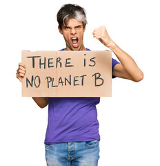 Sticker - Young hispanic man holding there is no planet b banner annoyed and frustrated shouting with anger, yelling crazy with anger and hand raised