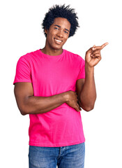 Poster - Handsome african american man with afro hair wearing casual pink tshirt smiling happy pointing with hand and finger to the side