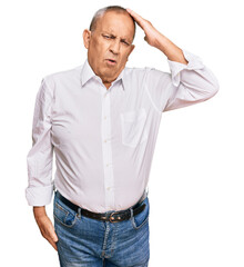 Canvas Print - Handsome senior man wearing elegant white shirt confuse and wonder about question. uncertain with doubt, thinking with hand on head. pensive concept.