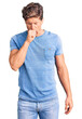© Krakenimages.com - Young handsome man wearing casual clothes feeling unwell and coughing as symptom for cold or bronchitis. health care concept.