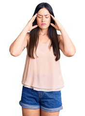 Sticker - Young beautiful caucasian woman wearing casual clothes suffering from headache desperate and stressed because pain and migraine. hands on head.