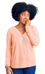 Wall Mural - Young african american girl wearing casual clothes looking stressed and nervous with hands on mouth biting nails. anxiety problem.