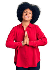 Sticker - Young african american girl wearing casual clothes begging and praying with hands together with hope expression on face very emotional and worried. begging.