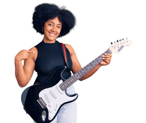 Wall Mural - Young african american girl playing electric guitar pointing finger to one self smiling happy and proud