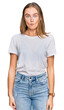© Krakenimages.com - Beautiful young blonde woman wearing casual white t shirt making fish face with lips, crazy and comical gesture. funny expression.