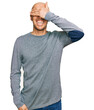 © Krakenimages.com - Bald man with beard wearing casual clothes smiling and laughing with hand on face covering eyes for surprise. blind concept.