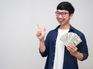 Cheerful businessman smile with holding money gesture point finger isolated