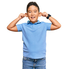 Wall Mural - Little boy hispanic kid wearing casual clothes smiling pulling ears with fingers, funny gesture. audition problem