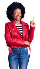 Poster - Young african american woman wearing red leather jacket smiling happy pointing with hand and finger to the side