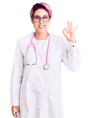 Poster - Young beautiful woman with pink hair wearing doctor uniform smiling positive doing ok sign with hand and fingers. successful expression.