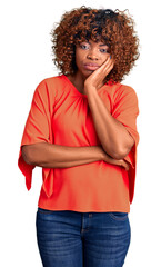 Sticker - Young african american woman wearing casual clothes thinking looking tired and bored with depression problems with crossed arms.