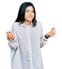 Poster - Young brunette woman with blue eyes wearing oversize white shirt doing money gesture with hands, asking for salary payment, millionaire business