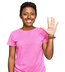 Wall Mural - Young african american woman wearing casual clothes showing and pointing up with fingers number five while smiling confident and happy.