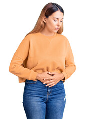 Canvas Print - Beautiful young woman wearing casual clothes with hand on stomach because indigestion, painful illness feeling unwell. ache concept.