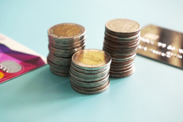 Stack of money coin on blue background, Saving money concept