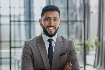 Portrait of successful young businessman in office