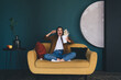 © BullRun - Scared woman scattering popcorn while watching movie