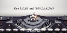 Rules And Regulationswritten By Typewriter. Typewriter And Text On White Sheet.