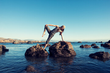 Free Spirit by the sea being yoga playful. 