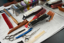 Array Of Hairstyling Tools Placed Neatly On Barber Table
