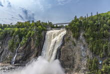 The Montmorency Falls (Chute Montmorency) Large Waterfall On Montmorency River Where It Drops Into The Saint Lawrence River In Quebec, Canada. Protected Within Montmorency Falls Park.