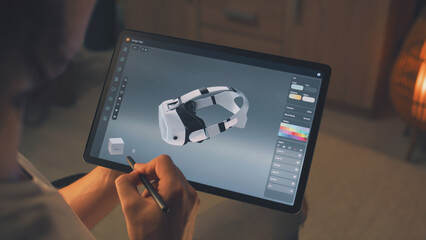 Wall Mural - young male 3d designer drawing and creating 3d prototype of vr headset in professional design applic
