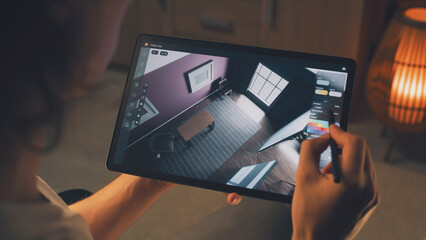 Wall Mural - male 3d designer using digital tablet computer and pencil and creating interior of house in professi