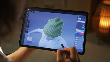 Wall Mural - young male 3d designer working remotely on 3d visualization of clothes in design app using digital t