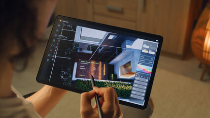 Wall Mural - male 3d designer having remote freelance project and working on smart house exterior in 3d modeling 