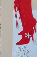 Sticker - paper flower, foam snowflake, and glyph or dingbat cutout of tall lace up stiletto boots