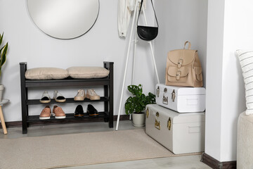 Poster - Hallway interior with shoe storage bench and houseplant