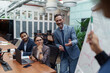 © Kostiantyn - A group of business people partners during a set team meeting in the modern office